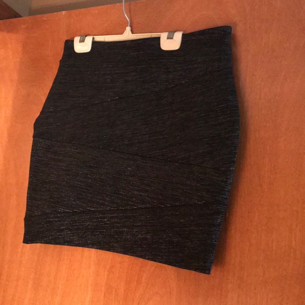 Black and silver mini skirt .